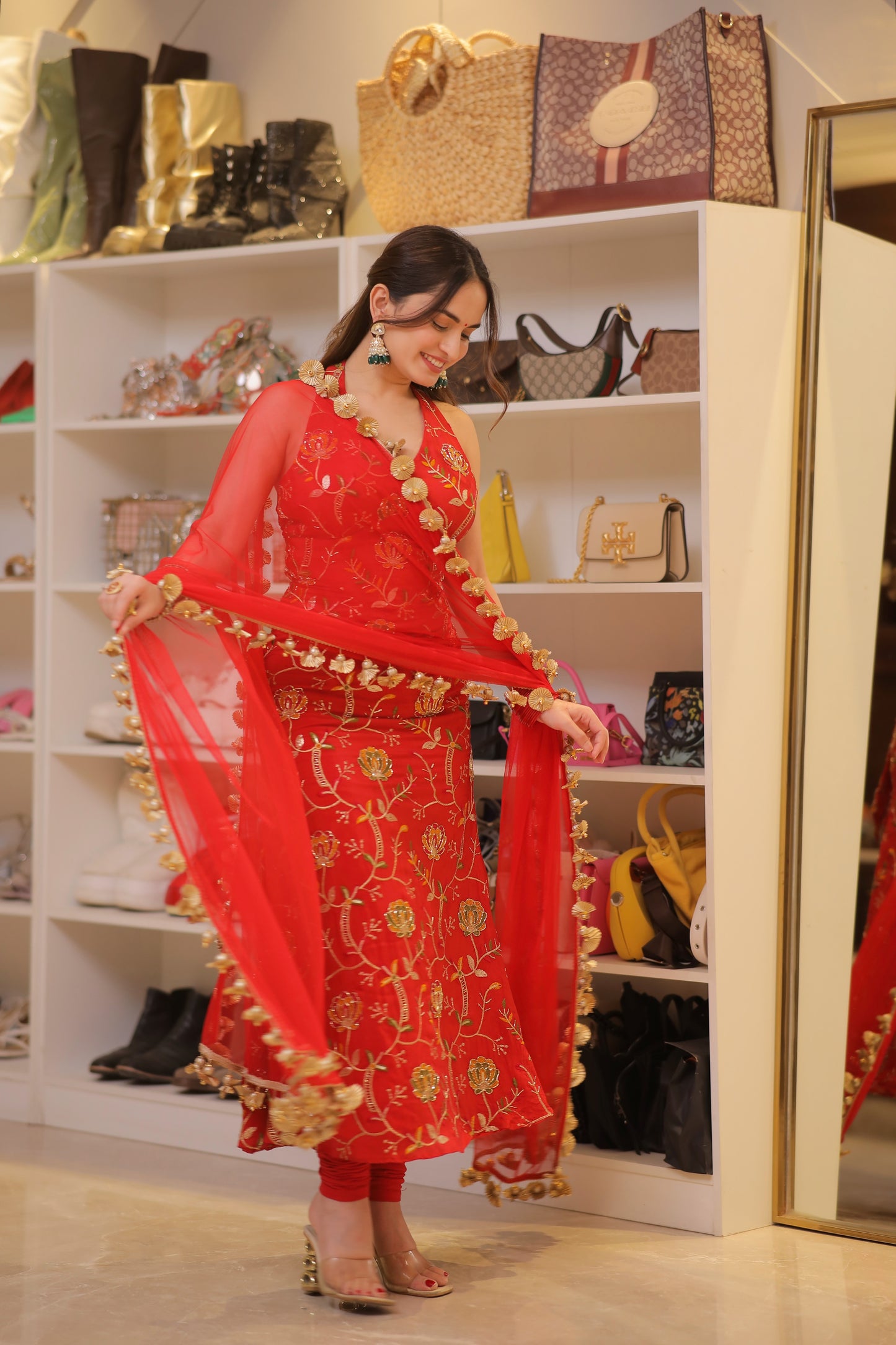 Manirika red suit by Imagine By Shiwali, featuring a stylish fit and elegant design, shown in a well-lit studio setting.