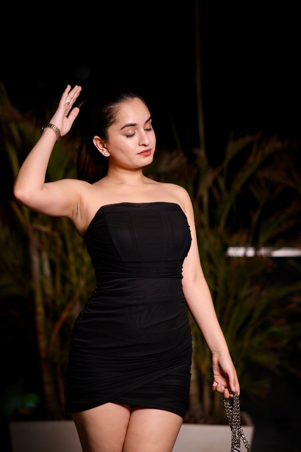Imagine By Shiwali Jossie Black Dress displayed on a hanger, showcasing its elegant design and classic black fabric.