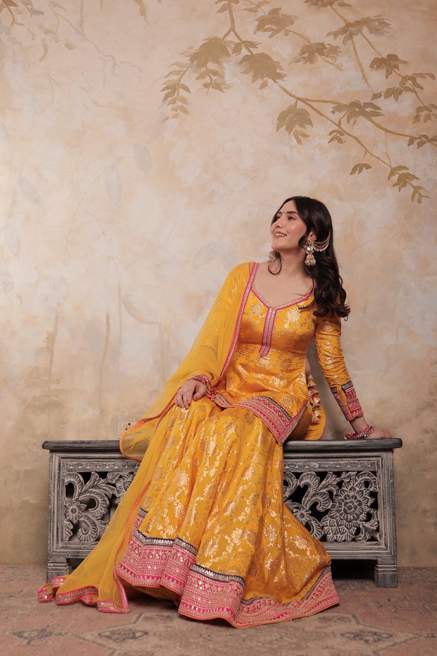 Yellow and pink Abhilasha sharara suit by Imagine By Shiwali, featuring vibrant traditional Indian attire with intricate detailing.