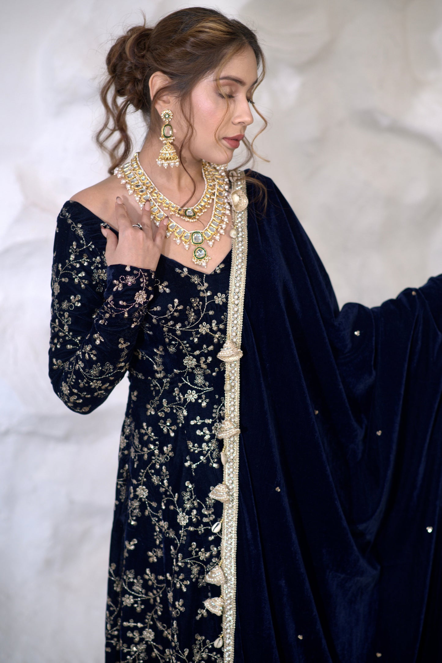 Navy blue velvet Anarkali dress from Malaika collection by Imagine By Shiwali with intricate embroidery and flowing silhouette.