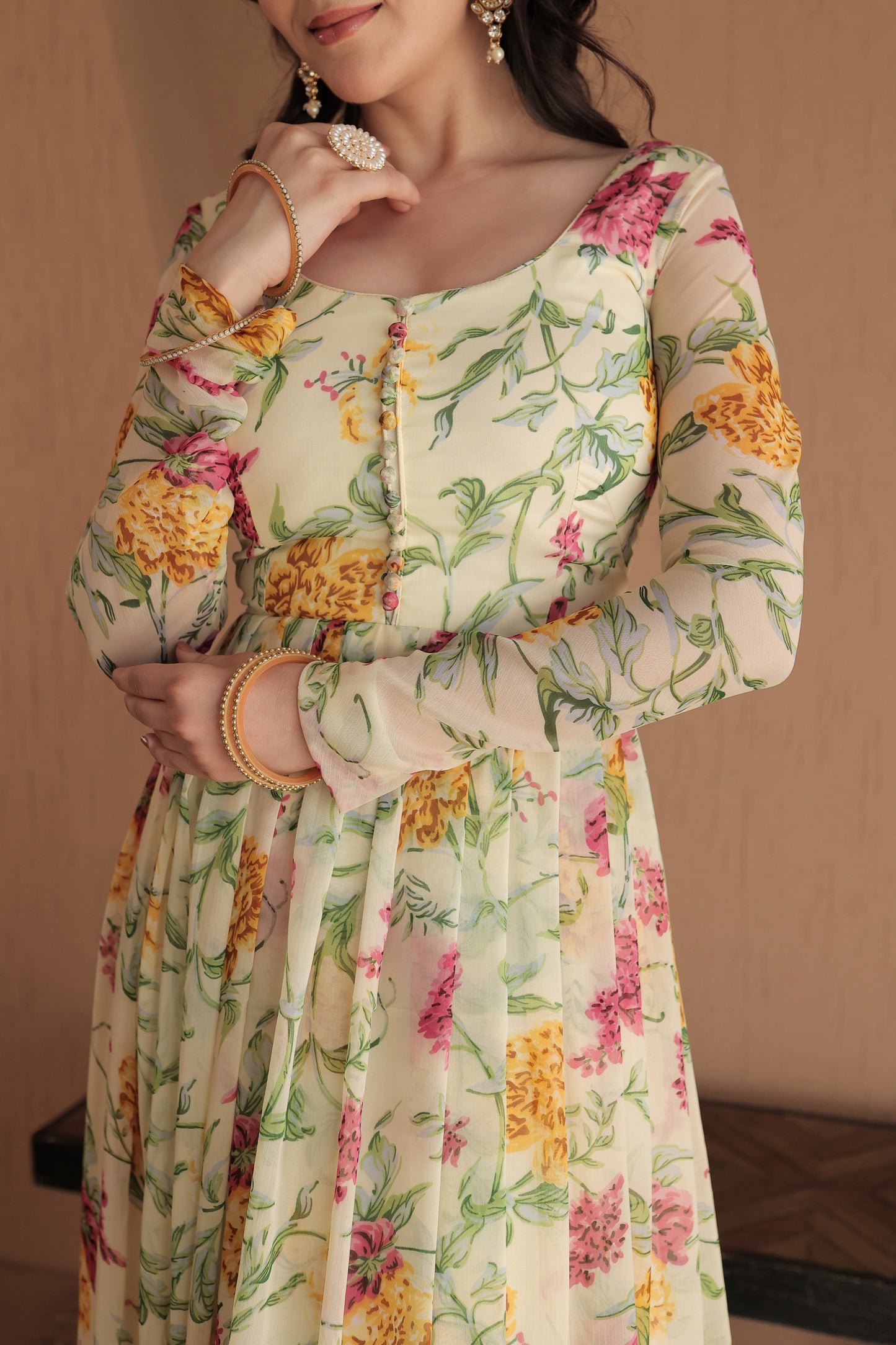 Beige floral Rasiya Anarkali dress by Imagine By Shiwali featuring intricate embroidery and flowy fabric.