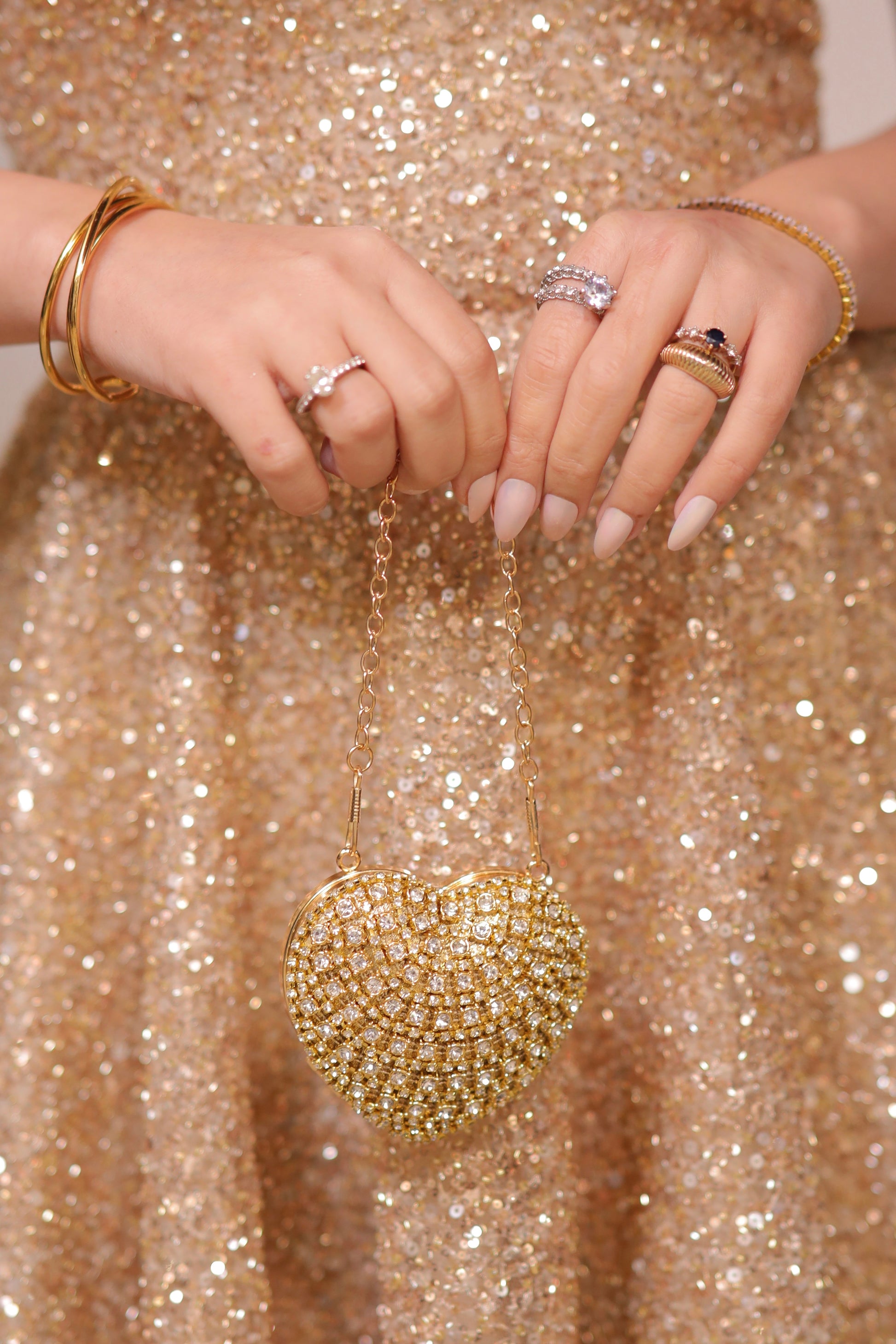 Sam Heart Bag by Imagine By Shiwali in golden color, featuring a heart-shaped design with a sleek, stylish appearance.