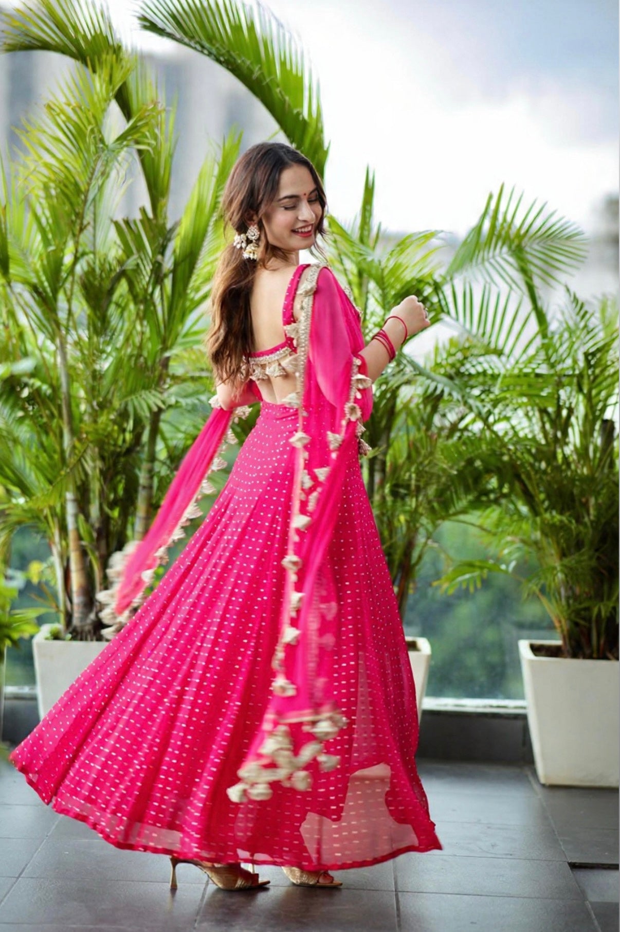 Hot pink Dolly Anarkali dress by Imagine By Shiwali, featuring intricate embroidery and flowing fabric.