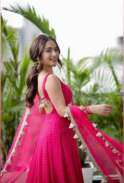 Hot pink Dolly Anarkali dress by Imagine By Shiwali featuring intricate embroidery and flowy fabric.