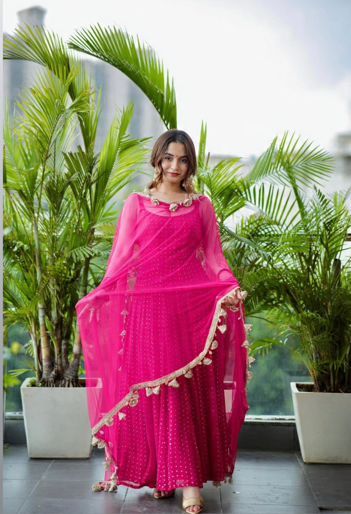 Bright hot pink Dolly Anarkali dress by Imagine By Shiwali, featuring intricate embroidery and flowing fabric.