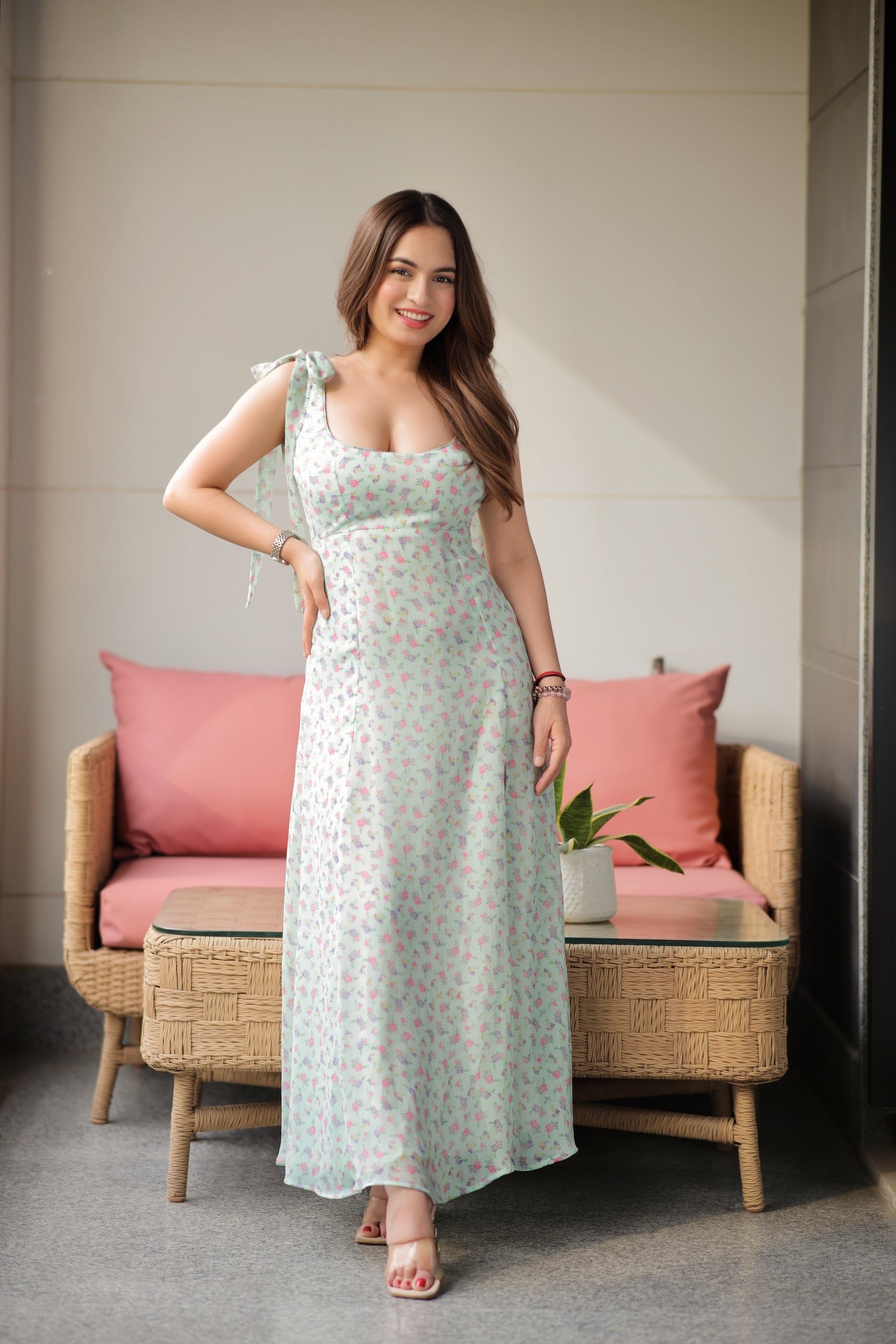Imagine by Shiwali Camille mint floral gown displayed on a hanger with intricate floral patterns and flowing fabric.