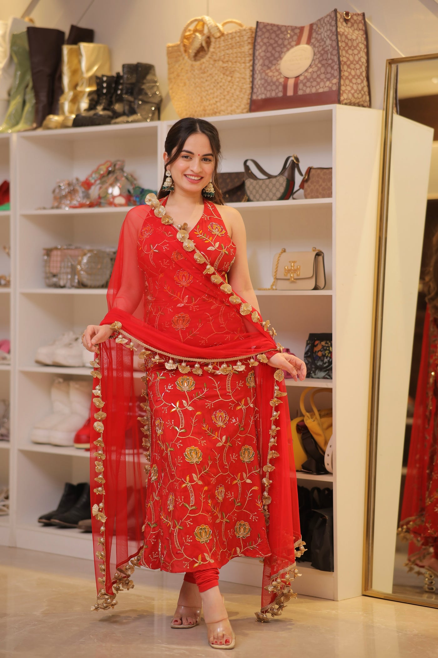 About Manirika Red Suit