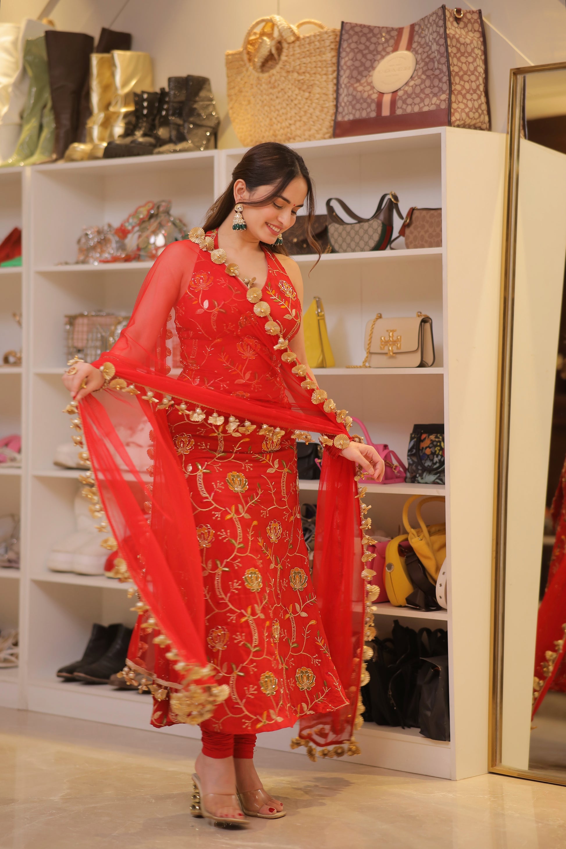 Manirika red suit by Imagine By Shiwali, featuring a stylish fit and elegant design, shown in a well-lit studio setting.