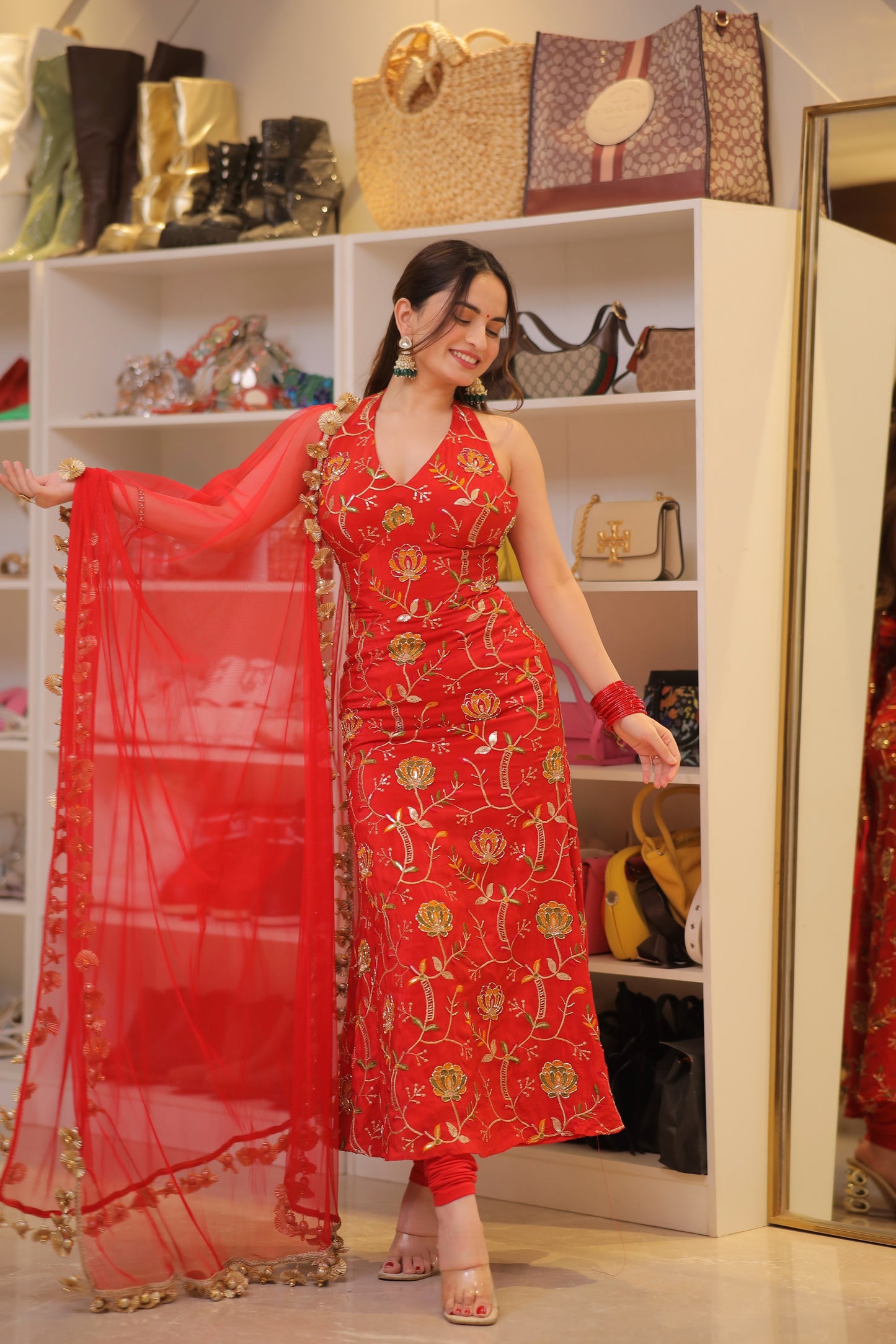 Red Manirika suit from Imagine By Shiwali featuring intricate traditional embroidery and elegant design.