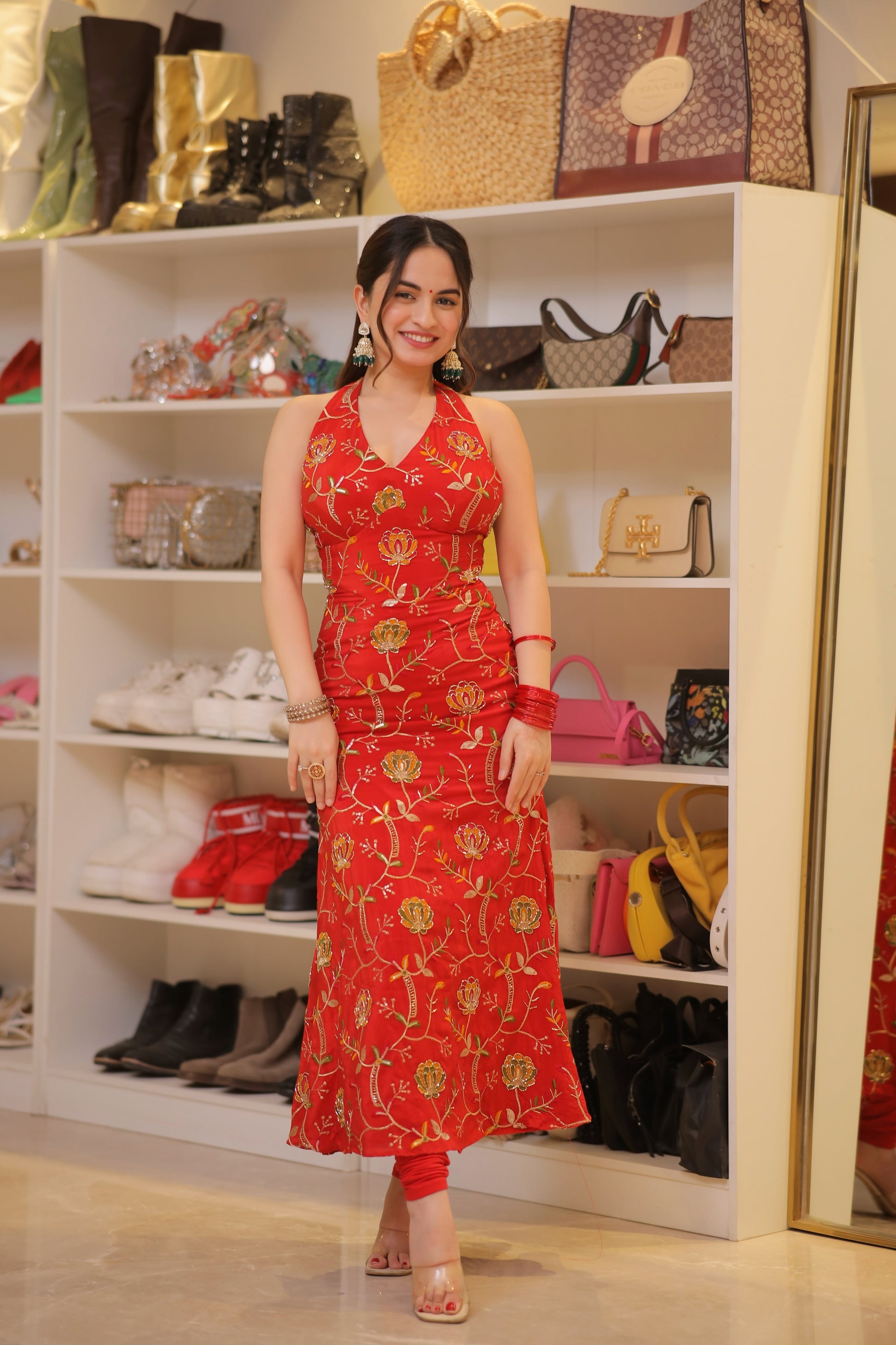 Red Manirika suit from Imagine By Shiwali featuring intricate embroidery and a tailored fit, displayed on a mannequin.