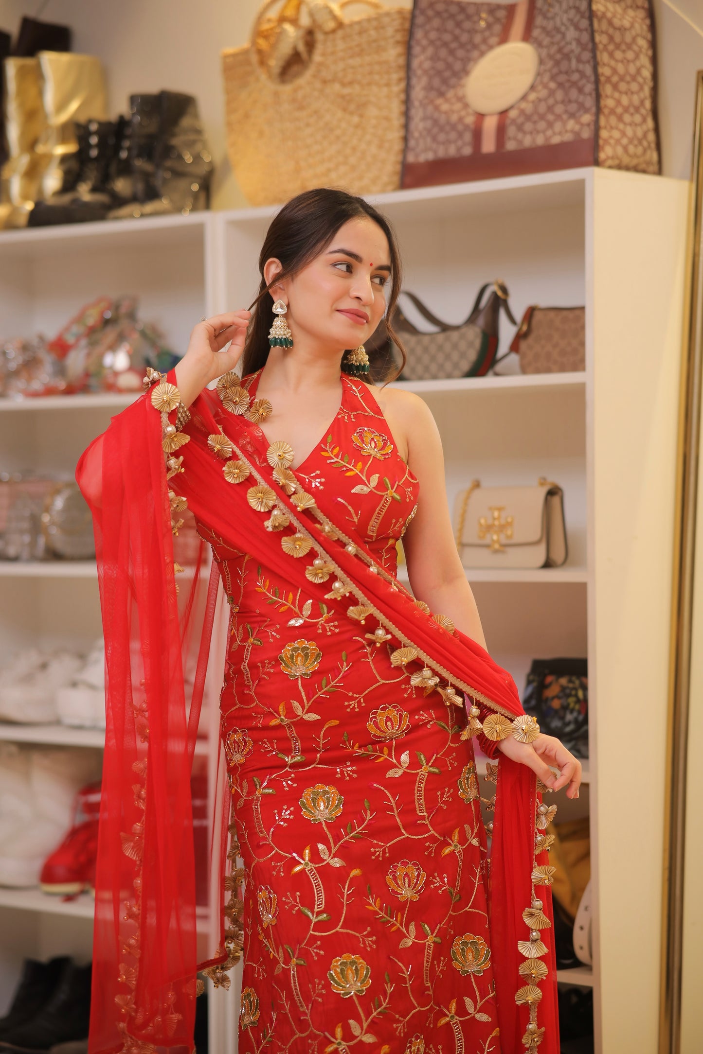 Red Manirika suit by Imagine By Shiwali featuring intricate embroidery and a fitted silhouette.