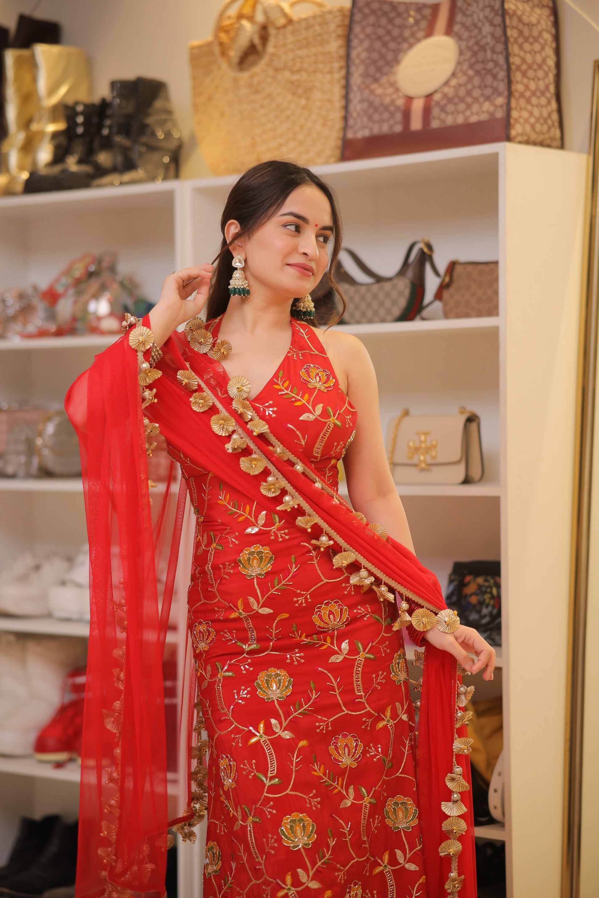 Red Manirika suit by Imagine By Shiwali featuring intricate embroidery and a fitted silhouette.