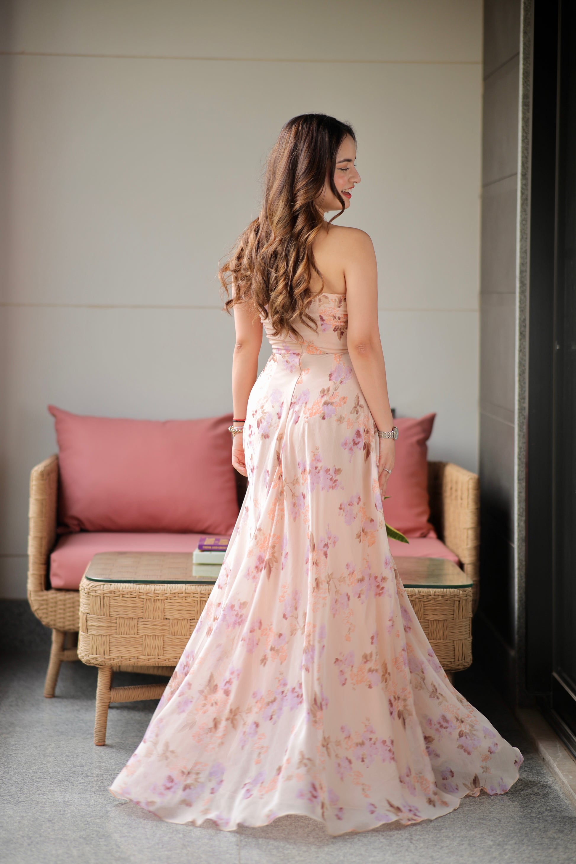 Imagine By Shiwali Rachel blush printed tube gown featuring a fitted silhouette and vibrant floral pattern.