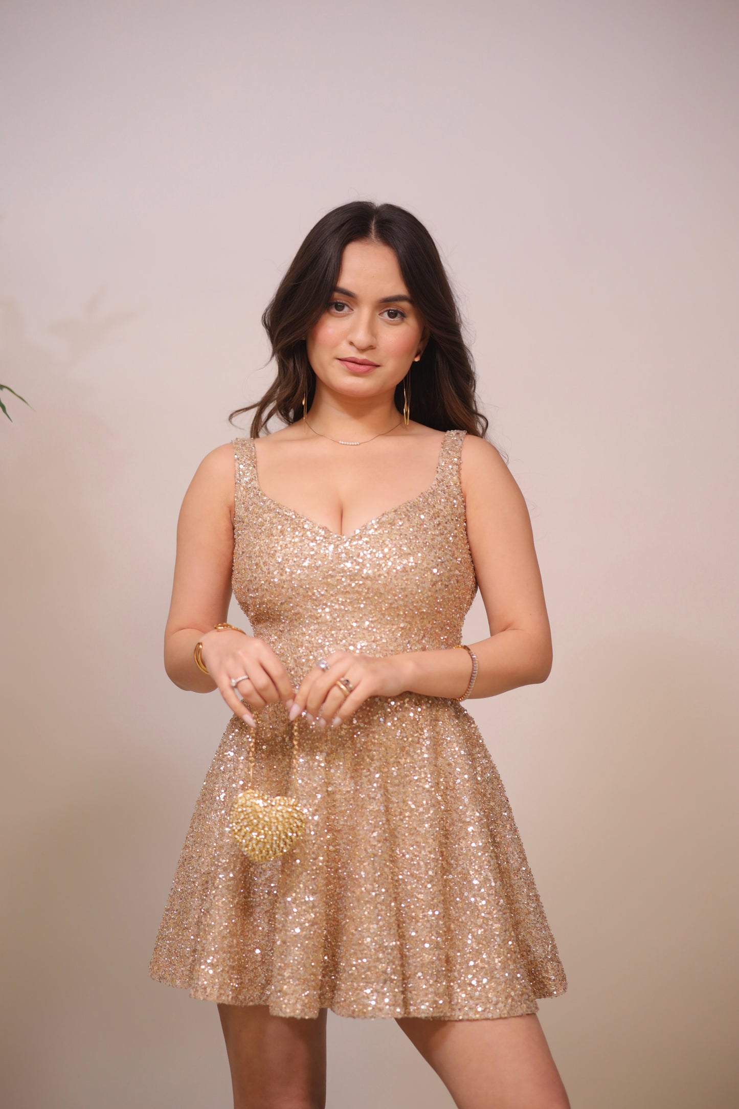 Golden Sam Heart Bag by Imagine By Shiwali featuring a chic heart-shaped design with a sleek gold finish and stylish strap.