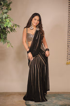 Black pre-draped saree by Imagine By Shiwali with intricate embroidery and elegant drape, showcased on a model.