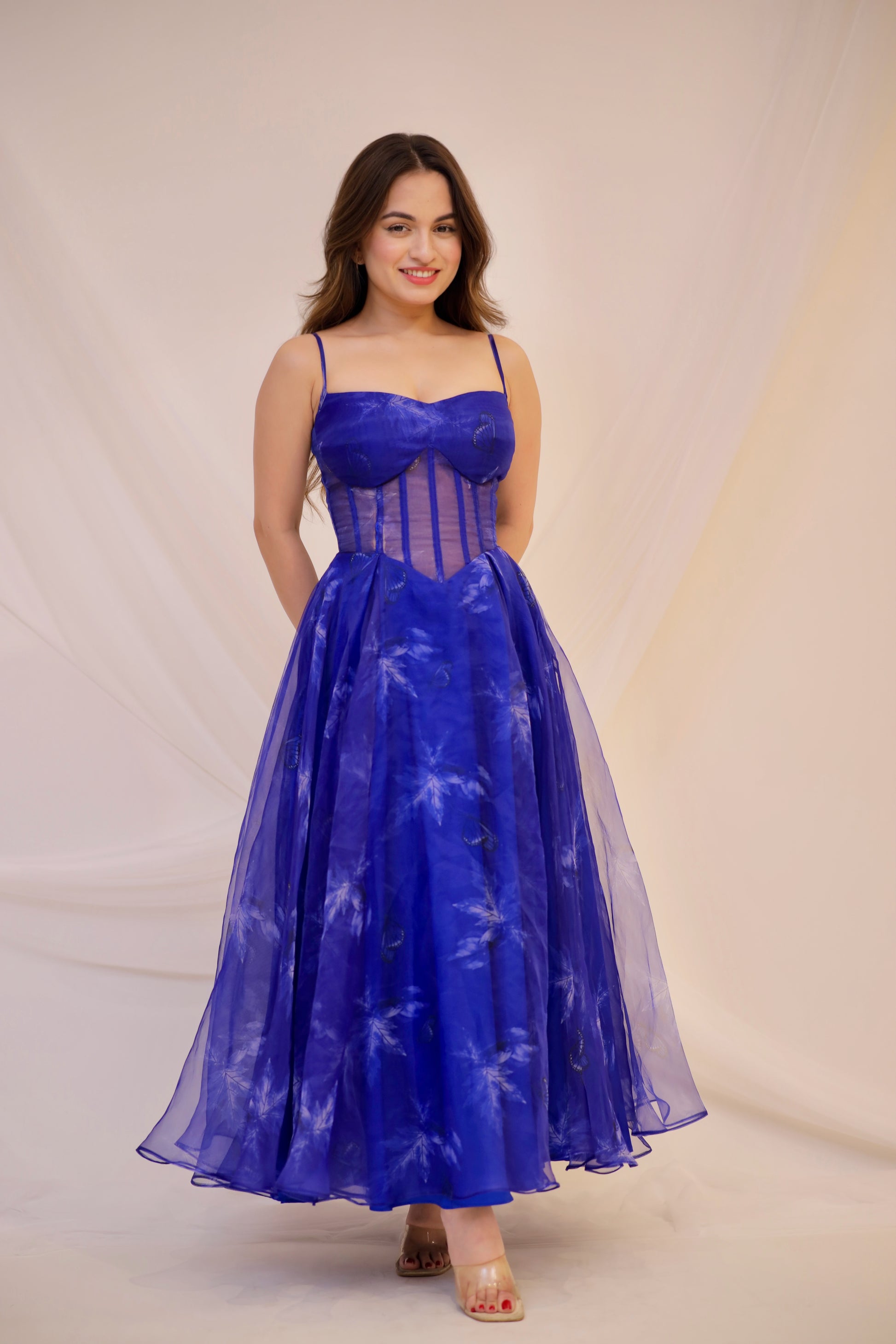 Blue electric gown by Imagine By Shiwali featuring intricate details and flowing fabric, shown in a stylish, elegant design.