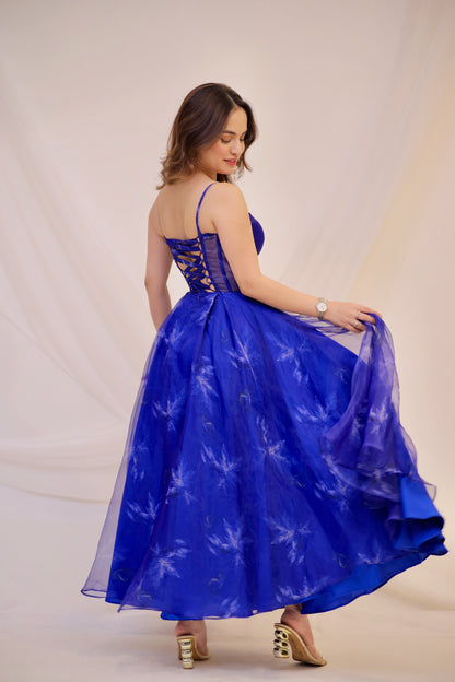 Dream blue electric gown by Imagine By Shiwali featuring a flowing fabric design and elegant fit, shown in a close-up view.