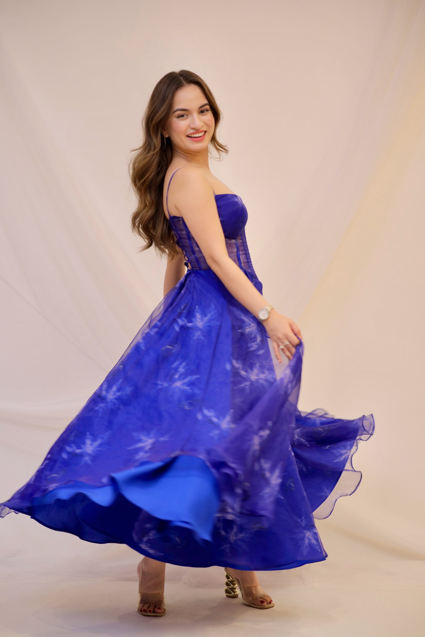 Dream blue electric gown by Imagine By Shiwali featuring flowing fabric and intricate design, shown on a model.