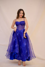 Blue electric gown by Imagine By Shiwali featuring intricate detailing and flowing fabric, showcased on a model with a stylish pose.