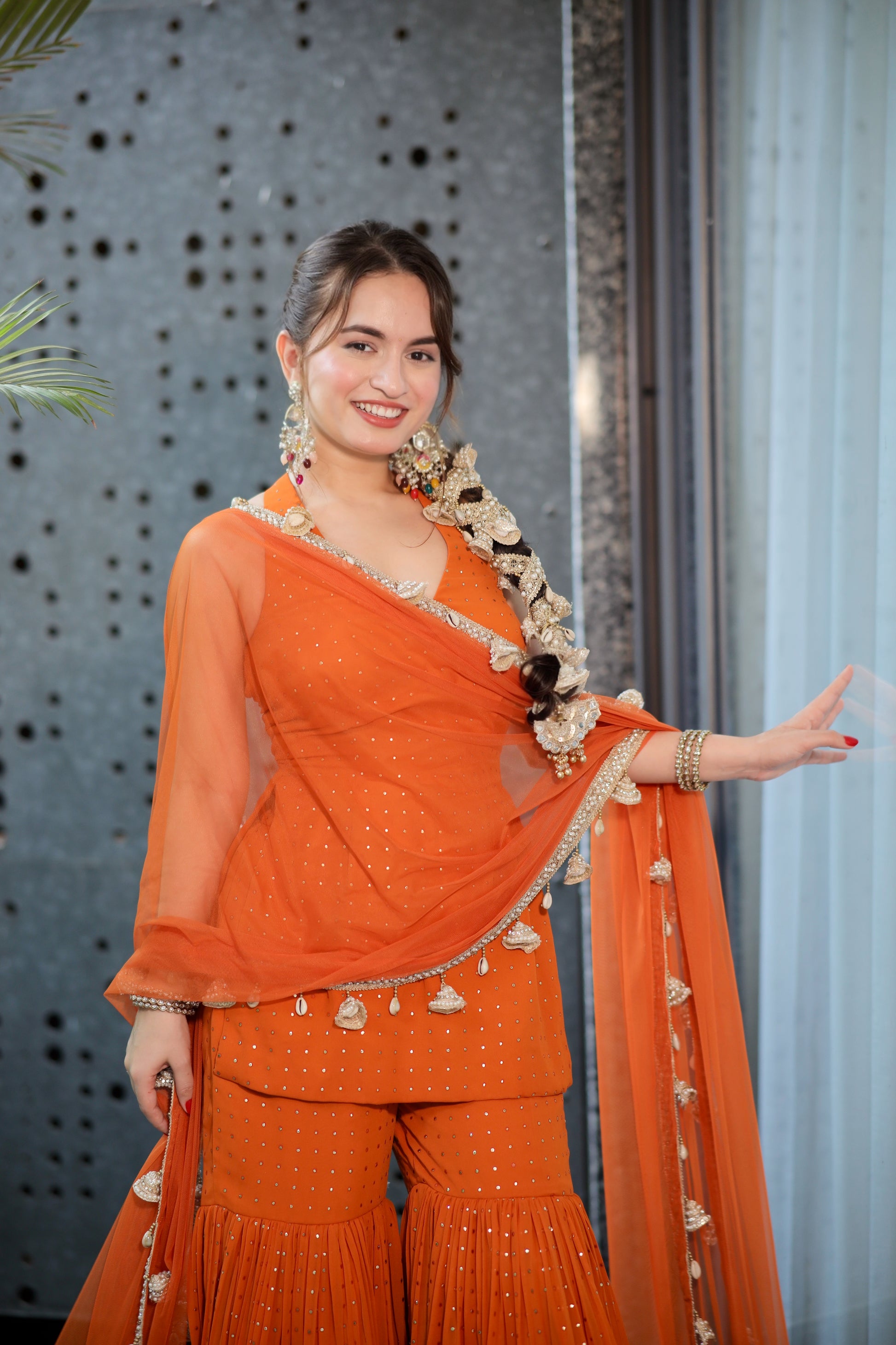 Rust Sharara suit from Imagine By Shiwali featuring intricate embroidery and a matching kurta with flared pants.