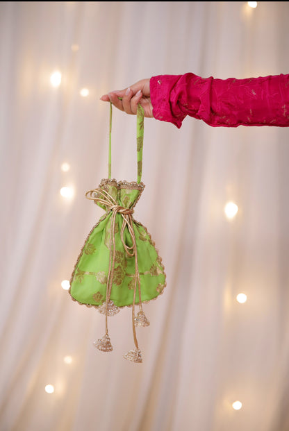 Sanvi Fuchsia Pink Lehenga with Embroidered Green Dupatta and Potli Bag