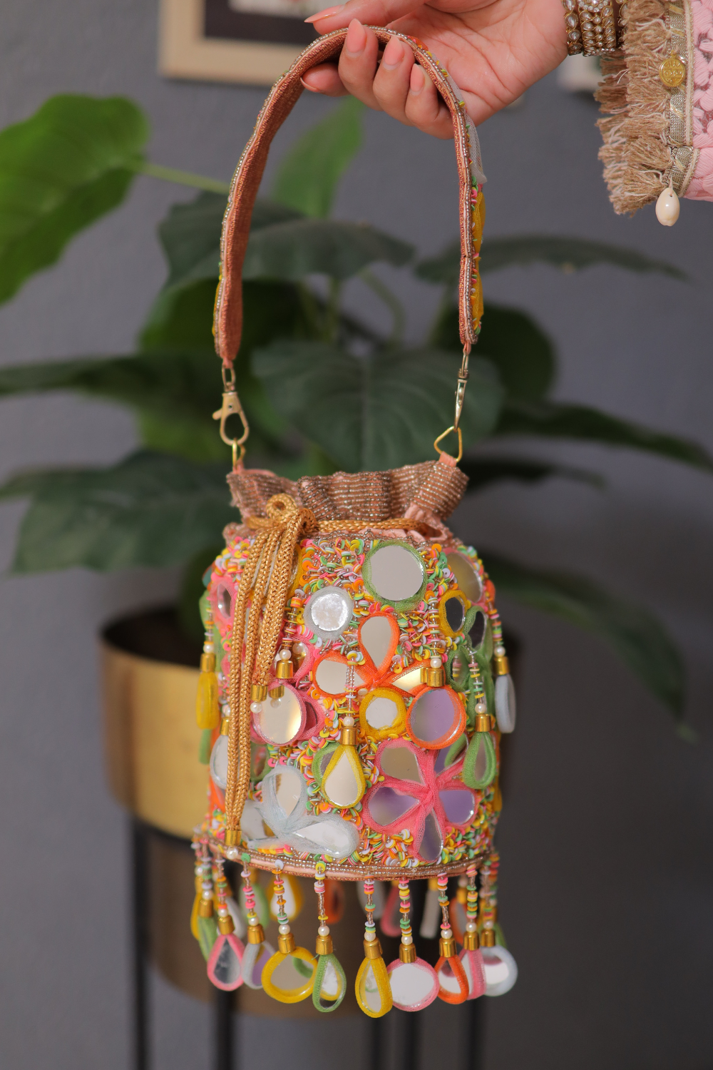 Multicolour Chameli bag by Imagine By Shiwali featuring geometric patterns and a stylish, vibrant design.