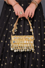 Rani golden mirrorwork bag by Imagine By Shiwali featuring intricate mirror embroidery and traditional design.