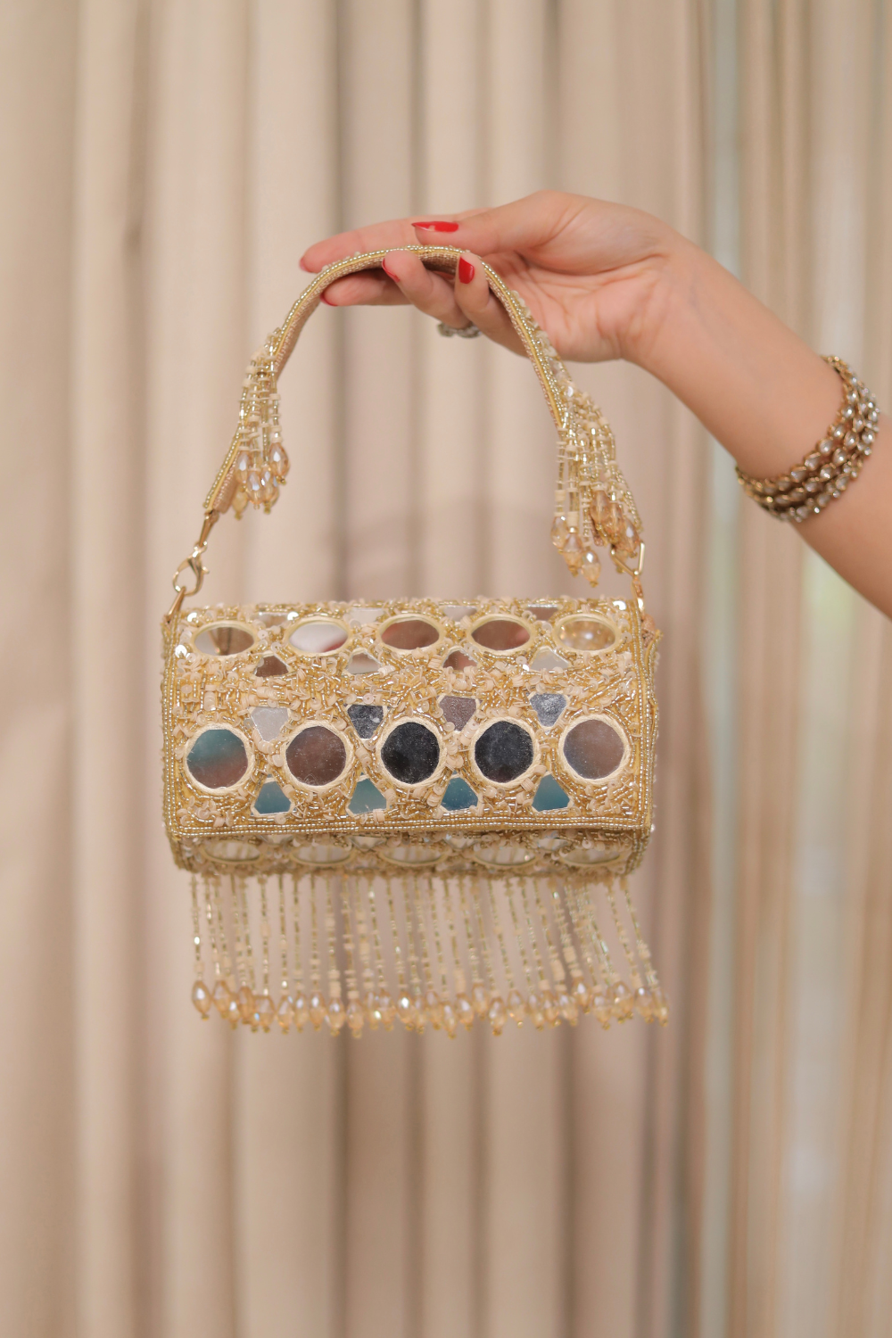 Imagine by Shiwali Rimjim mirror bag with a sleek design, featuring a reflective mirror surface and one-size fit.