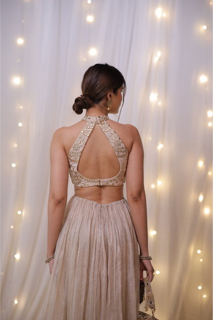Champagne gold halter Anarkali set with mirror embellishments by Imagine By Shiwali, featuring intricate mirror work and elegant design.
