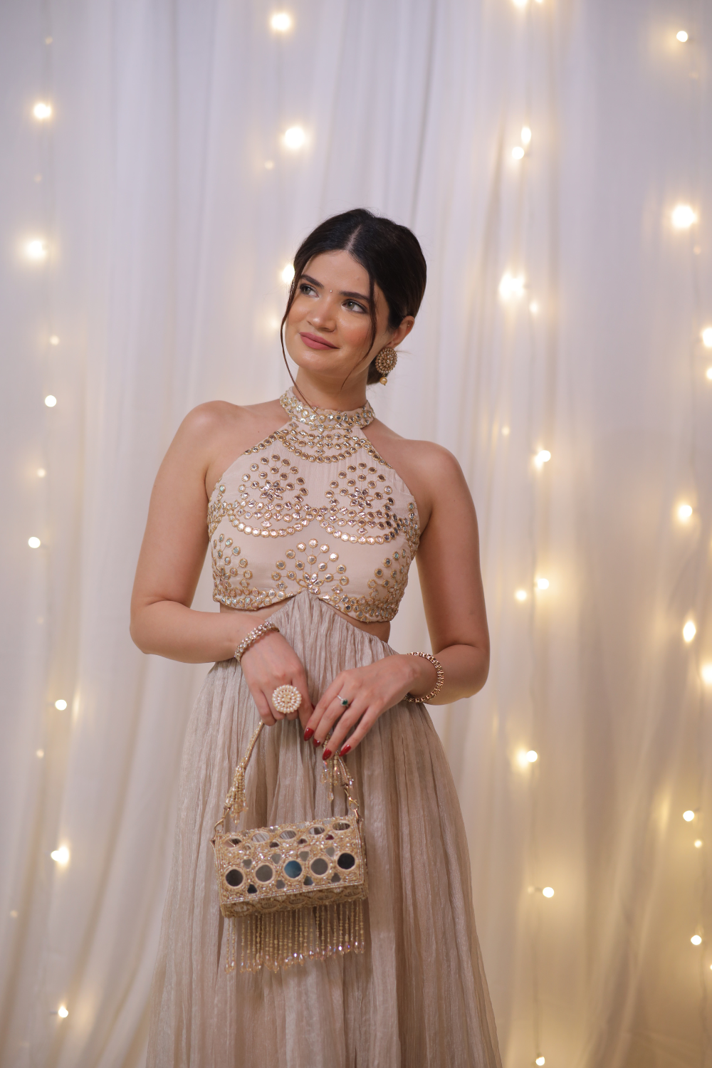 Champagne gold halter Anarkali set with mirror embellishments by Imagine By Shiwali, featuring intricate embroidery and a flowing design.