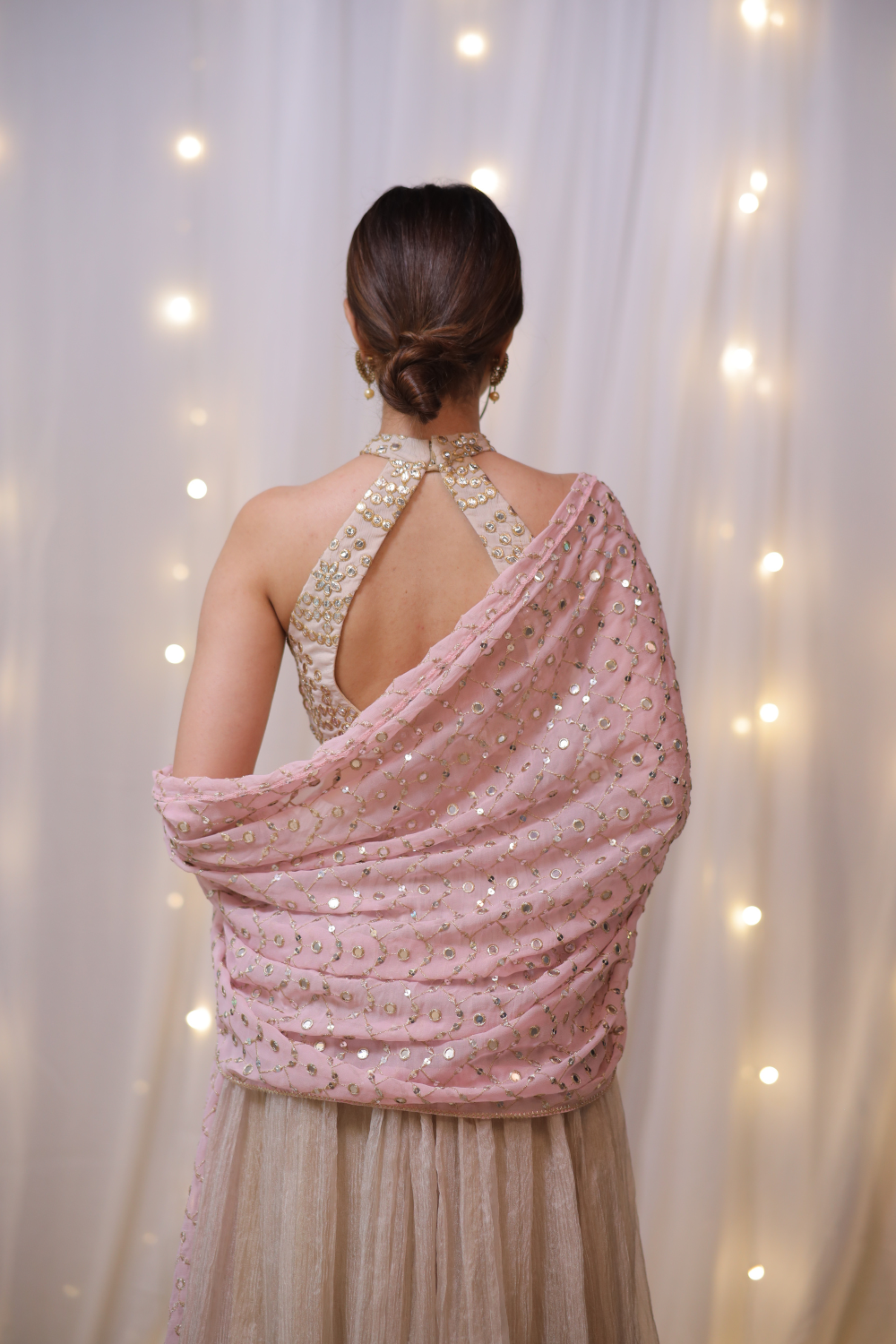 Champagne gold halter Anarkali set with mirror embellishments by Imagine By Shiwali, featuring intricate embroidery and elegant design.