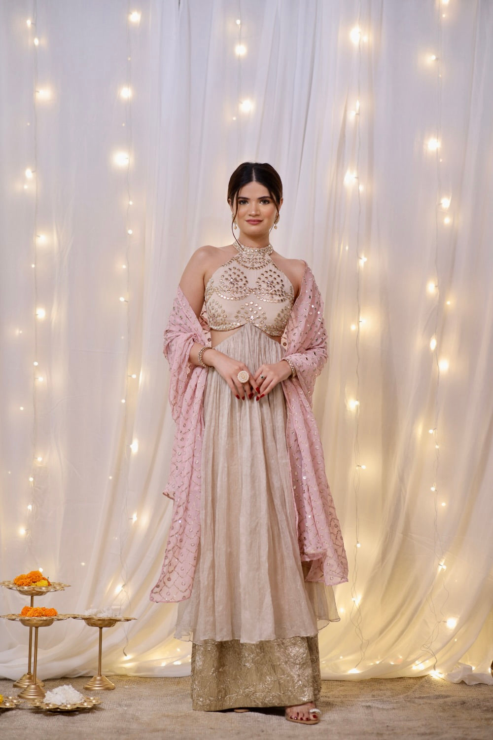 Champagne gold halter Anarkali set with mirror embellishments by Imagine By Shiwali, featuring intricate details and elegant design.