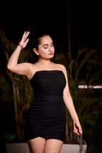 Imagine by Shiwali Jossie Black Dress displayed on a hanger, showcasing a stylish knee-length black dress with elegant detailing.
