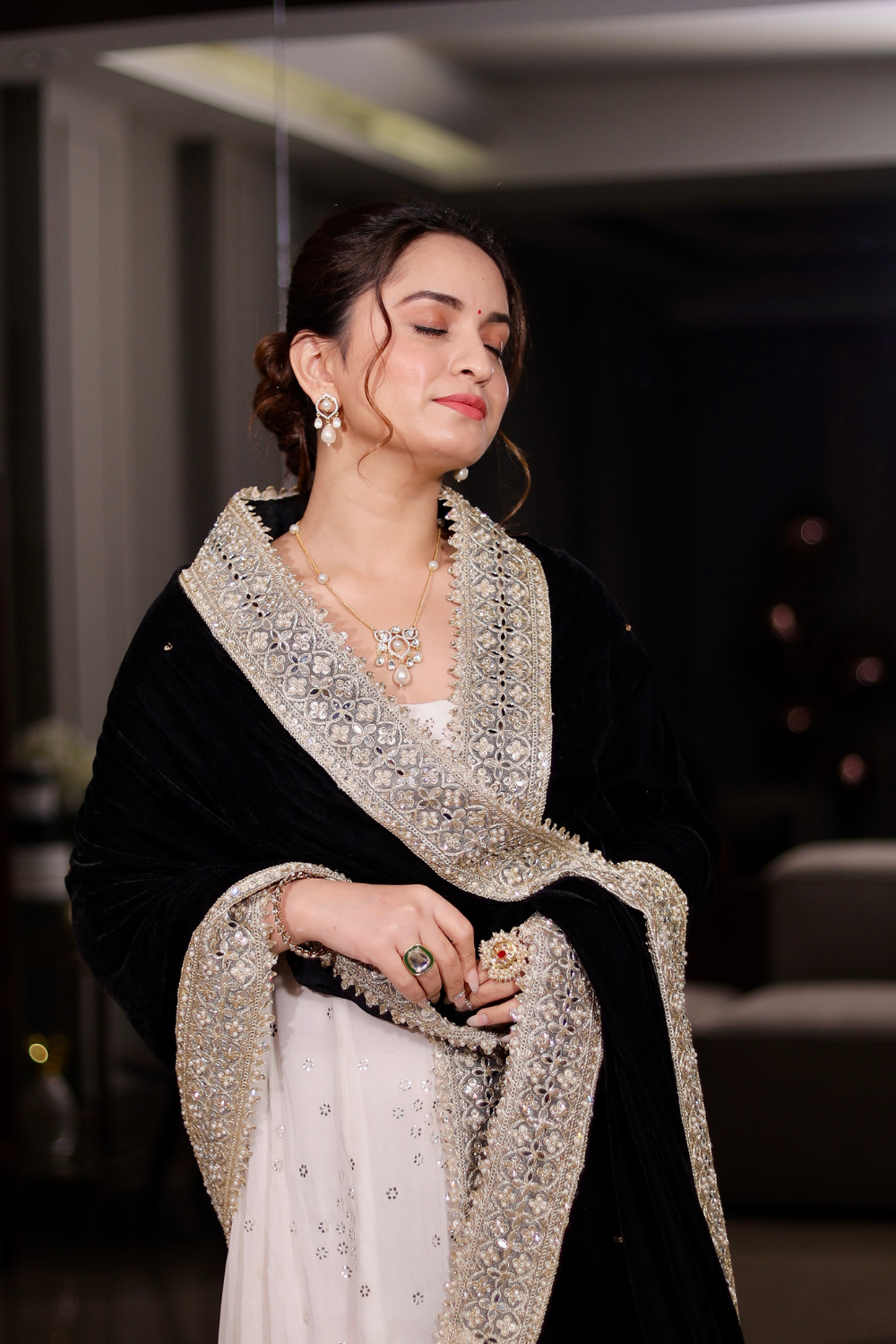Black Maastani Velvet Shawl by Imagine By Shiwali displayed draped with intricate velvet patterns and soft texture.