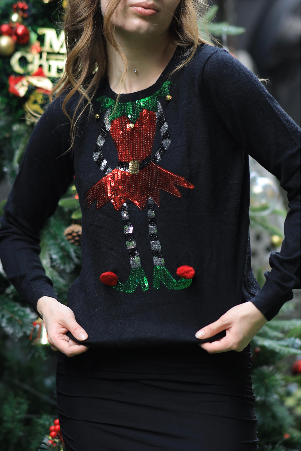 Imagine by Shiwali oversized elf sweater featuring a cozy, festive design in soft knit fabric, perfect for holiday wear.