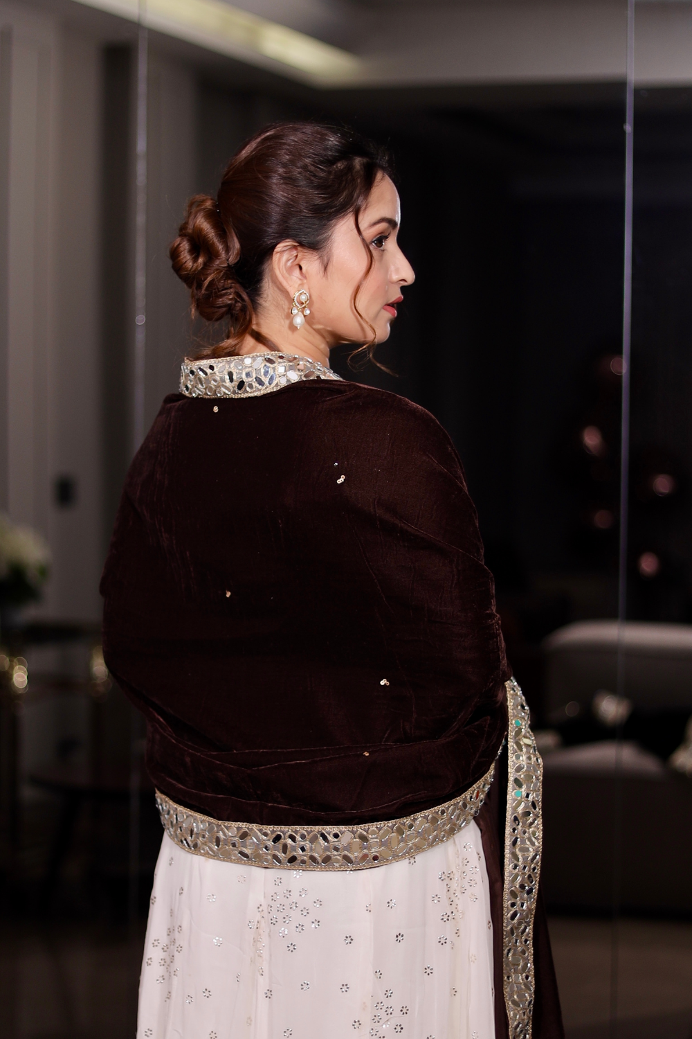 Brown Raveena Velvet Shawl by Imagine By Shiwali displayed draped over a mannequin. Luxurious velvet fabric with intricate patterns.
