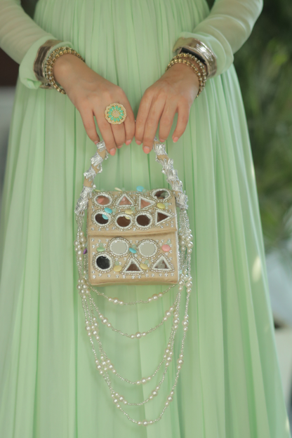 Roma Watergold color mirrorwork bag by Imagine By Shiwali, featuring intricate mirror embroidery and stylish design.
