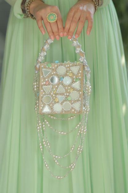 Roma watergold color mirrorwork bag by Imagine By Shiwali featuring intricate mirror embellishments and elegant design.
