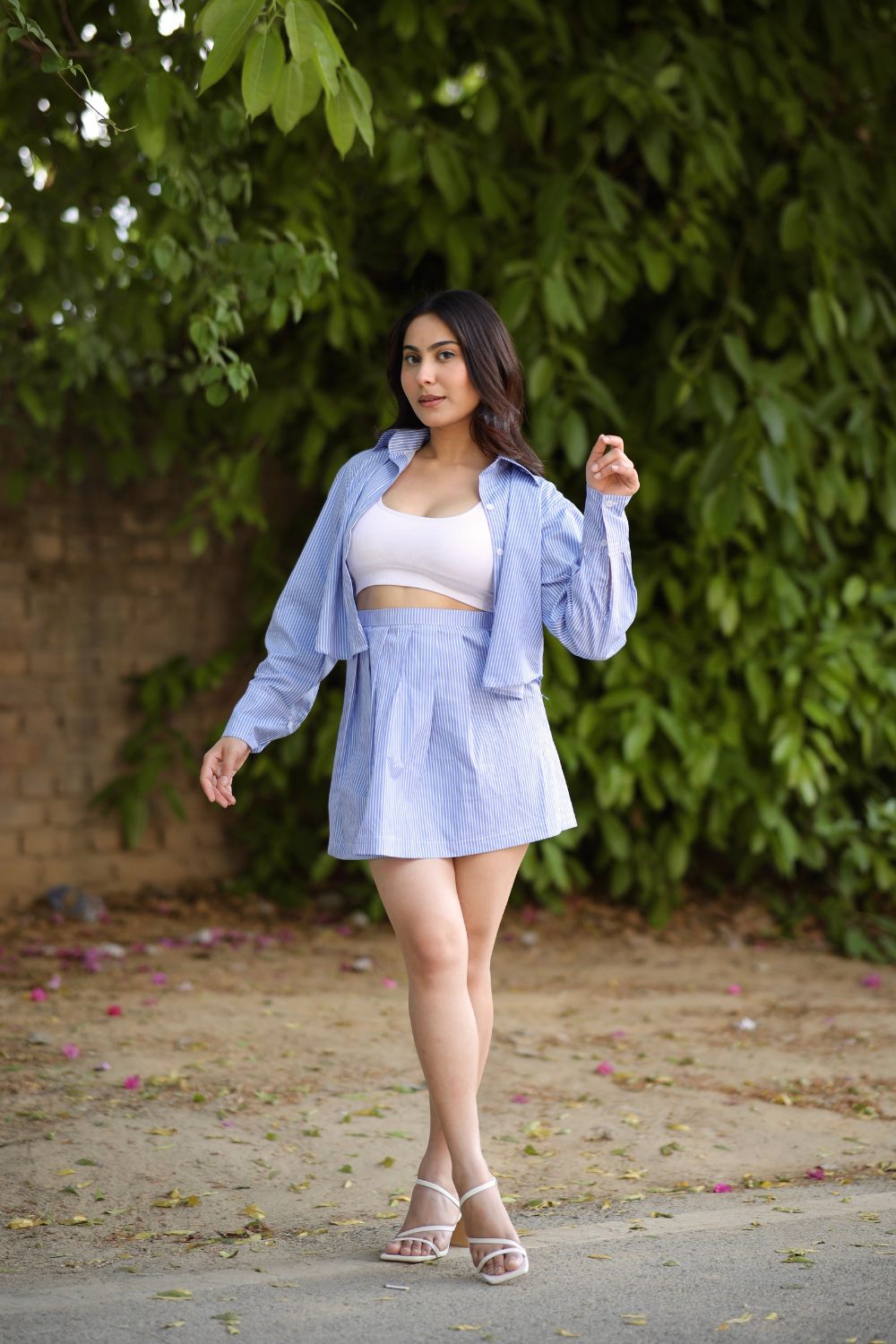 Imagine By Shiwali blue golf shirt and skirt set, made of 100% cotton, shown on a model with the shirt and skirt styled together.