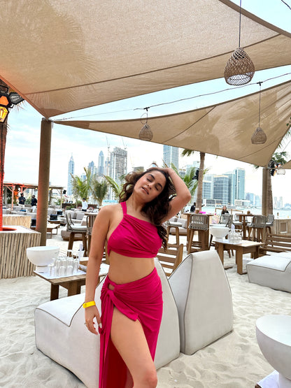 Hot pink ruched tank crop top and slit skirt by Imagine By Shiwali, styled together in a vibrant fashion ensemble.