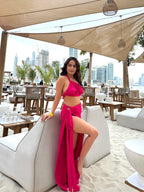 Hot pink ruched tank crop top and slit skirt by Imagine By Shiwali, styled together in a vibrant, fashionable ensemble.