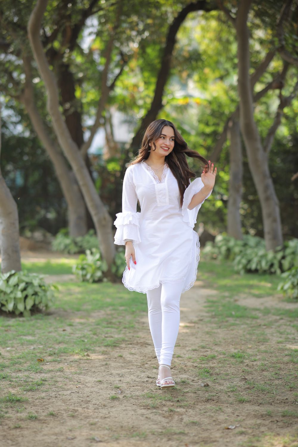 Pure white cotton kurti by Imagine By Shiwali featuring a simple, elegant design and comfortable fabric.