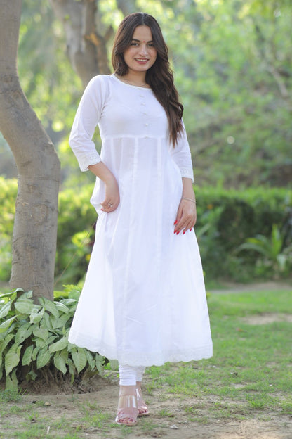 White cotton Anarkali with matching leggings from Imagine By Shiwali, featuring intricate embroidery and elegant design.