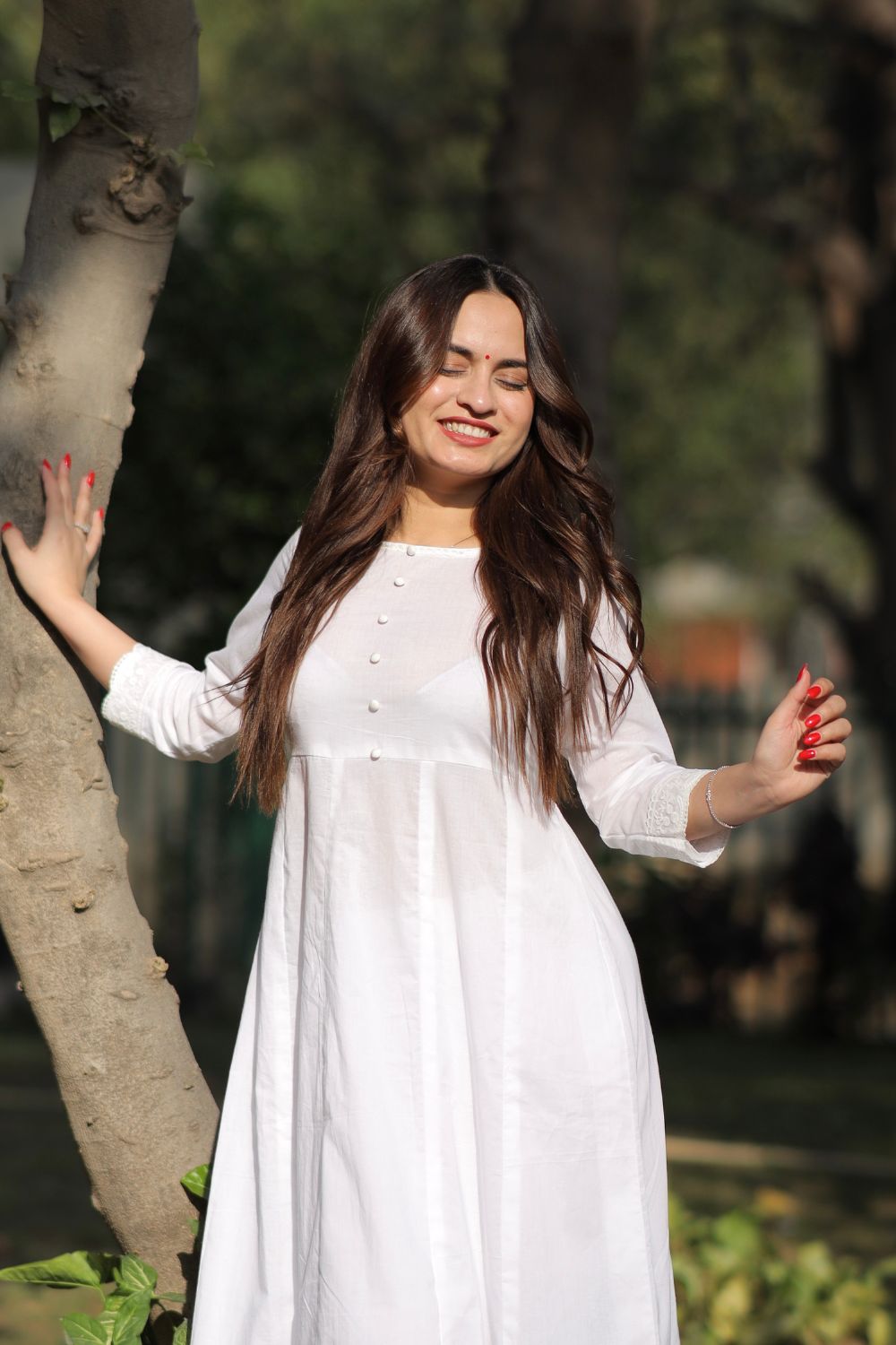 White cotton Anarkali with leggings from Imagine By Shiwali, showing the elegant design and fabric details.