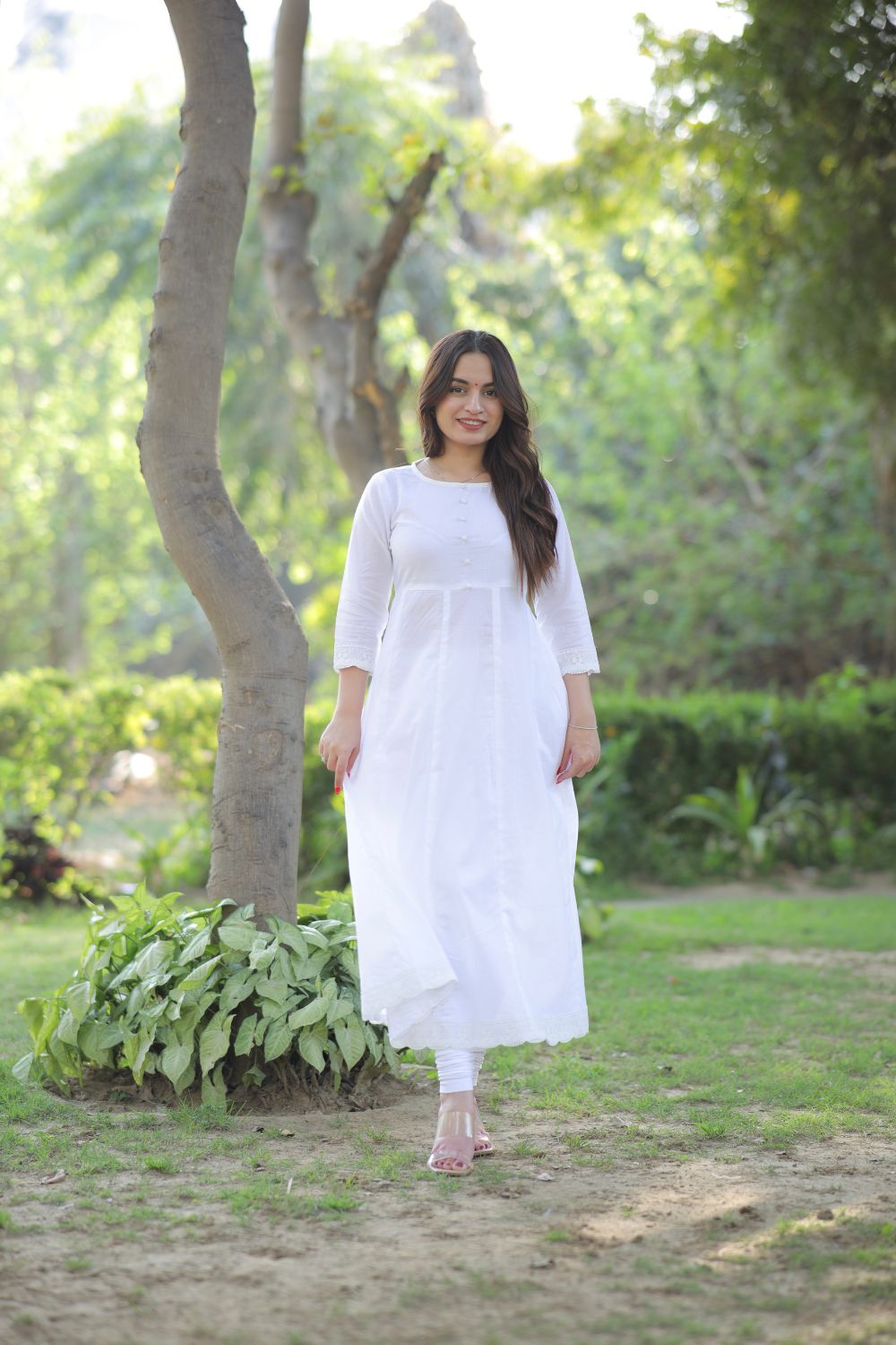 White cotton Anarkali suit with matching leggings by Imagine By Shiwali, featuring traditional embroidery and comfortable fit.