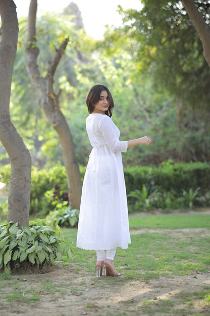 White cotton Anarkali suit with matching leggings from Imagine By Shiwali, featuring intricate embroidery and comfortable fit.