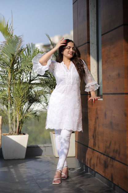 White cotton organza kurti by Imagine By Shiwali, showcasing intricate fabric texture and elegant design details.