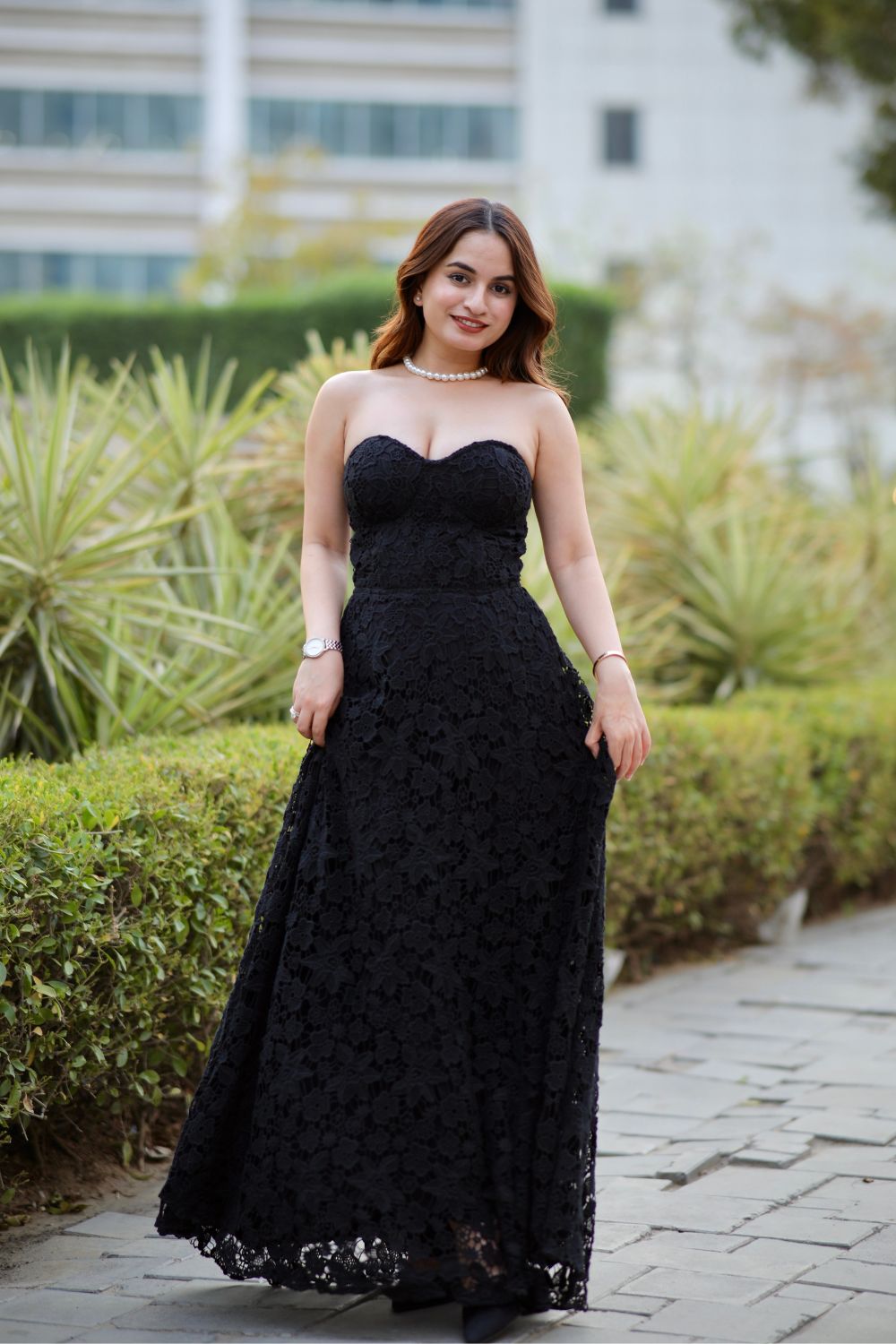 Imagine by Shiwali Bella black dress displayed on a hanger, showcasing its elegant fabric and classic design.