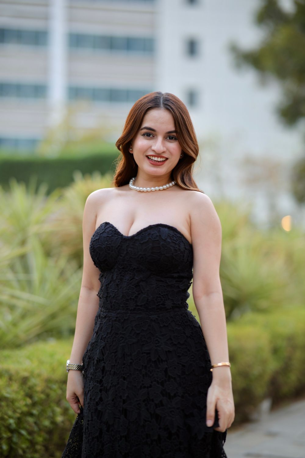 Black Bella dress by Imagine By Shiwali, showcasing a stylish sleeveless design with a fitted silhouette and elegant neckline.