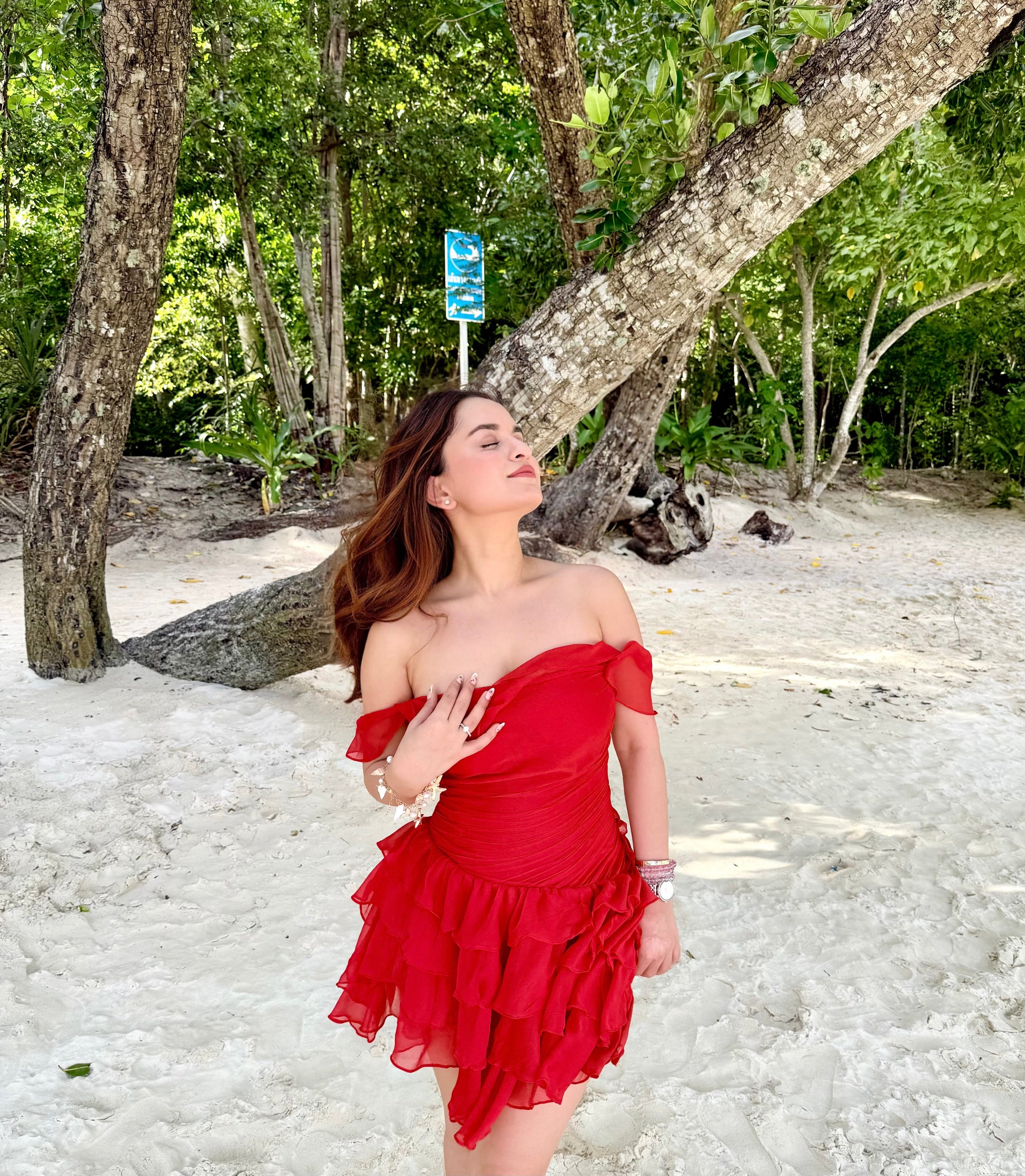 Imagine By Shiwali Casey Red Dress, front view showing sleeveless design and knee-length cut, vibrant red fabric and fitted silhouette